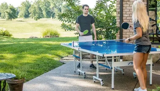 Outdoor ping pong table at The Retreat of Broward, a detox center in Miami, surrounded by lush greenery.