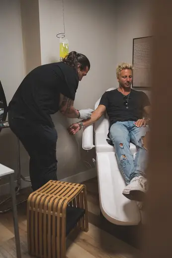 Comfortable treatment chair at The Cure Wellness detox center in Miami with a patient receiving care.