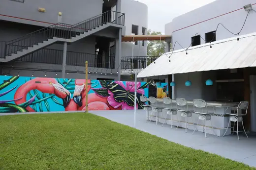 Vibrant outdoor patio with mural at Aspen Behavioral Health, a partial hospitalization program in Miami.